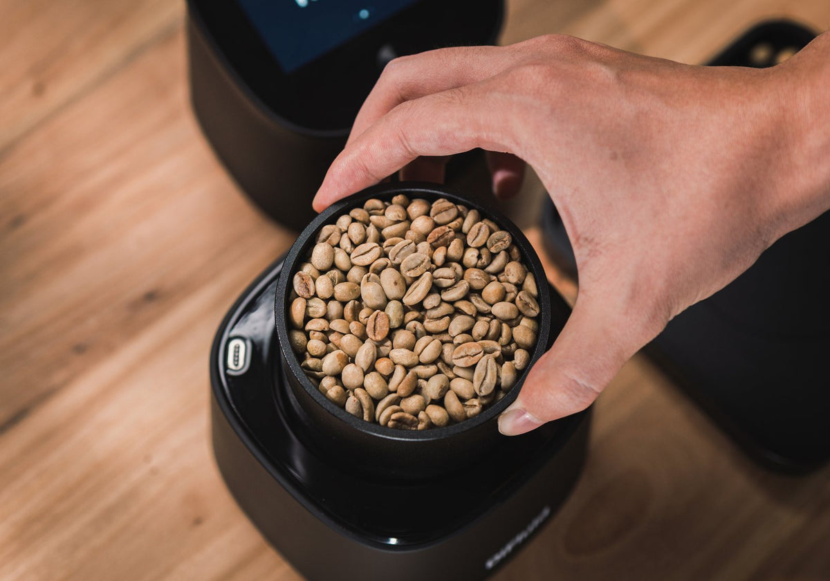 Omix Plus coffee quality analyzer with a green coffee sample